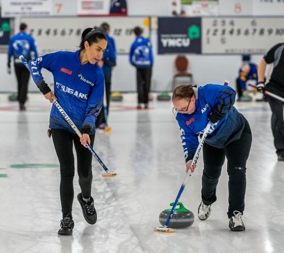 Sault College women's curling team members during a match