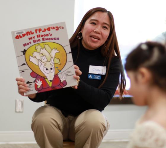 ECE student reading story to children