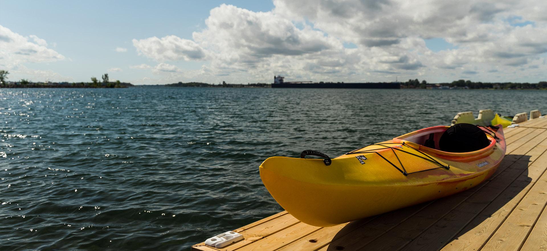 view of waterfront and yellow kayak on the dock