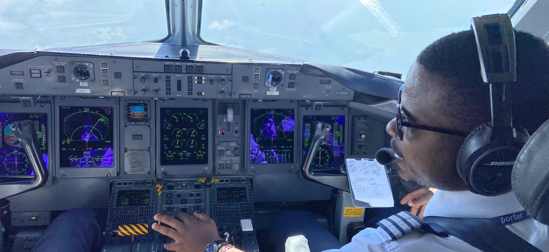 George a graduate of our Aviation program shown in a cockpit during flight