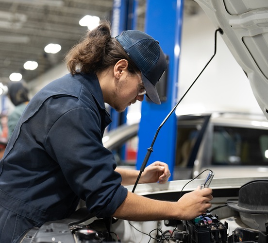 Motive Power Student checking engine