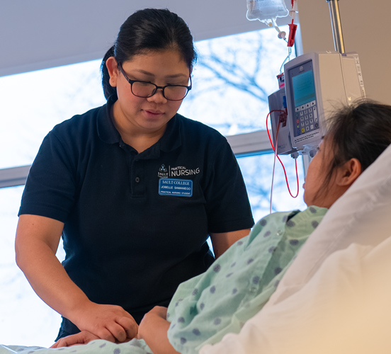 Practical Nursing student checking vitals on patient