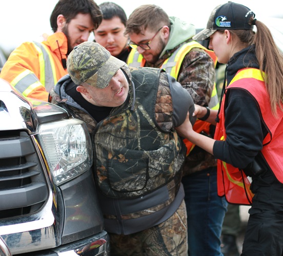 Environmental Enforcement students arresting someone in mock vehicle inspection