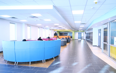 interior photo of campus in ie3 showing seating areas to the left of a walkway