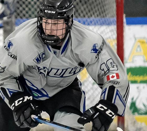 Sault College hockey player skating down the ice