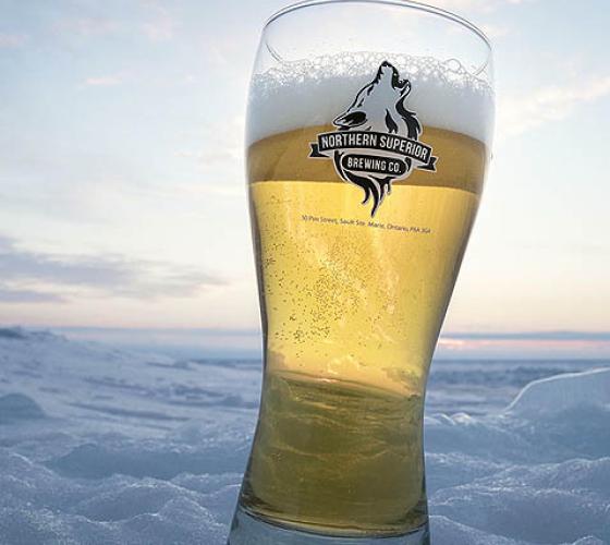 Northern Superior glass with beer