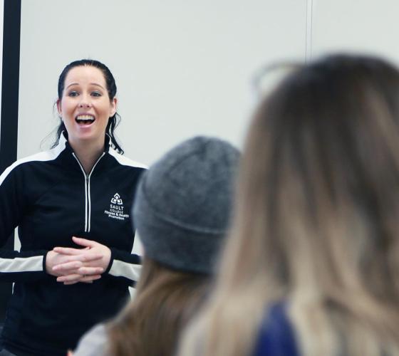 Female instructor teaching class.