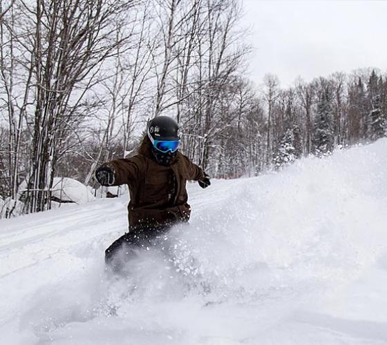 Snowboarder stopping.