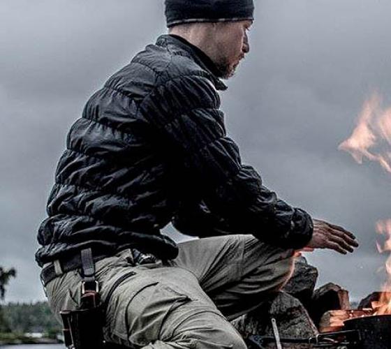 Student sitting by the campfire