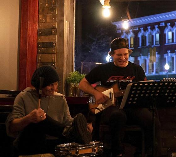 Two male musicians performing at the Whisky Barrel.