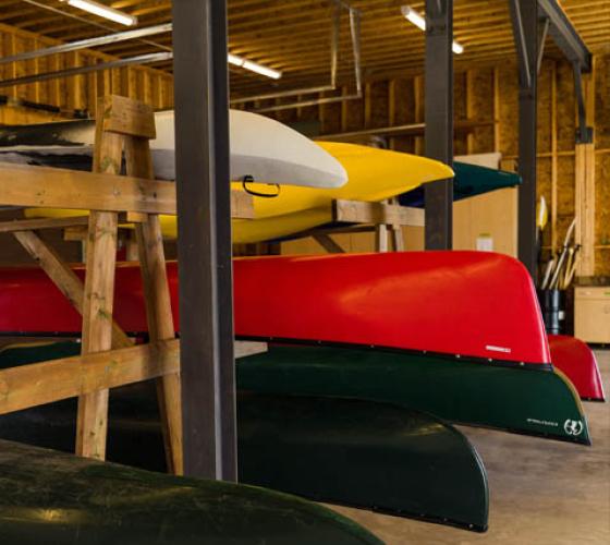 Inside garage of canoes