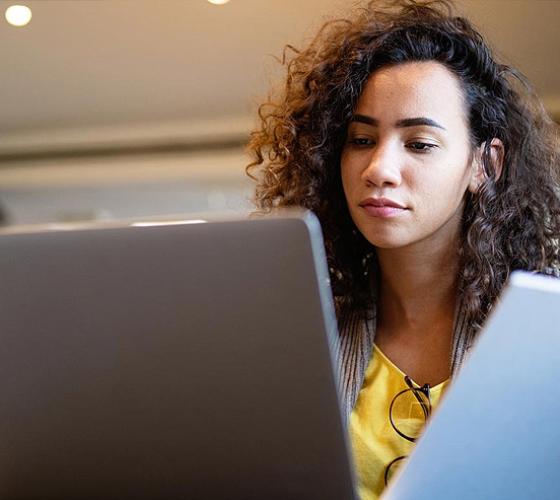 Student reviewing admission guides on the computer