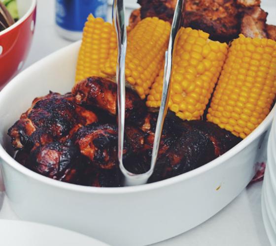 Barbecue food and corn on the cob.