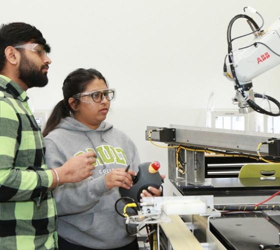 Engineering students working together in robotics lab