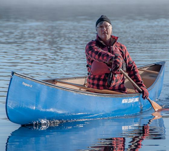 Kevin a graduate of our School of Natural Environment shown rowing a canoe