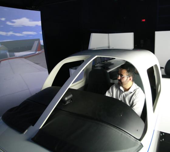 Aviation student in flight simulator