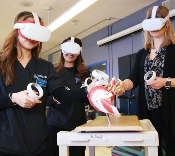 OTA & PTA students and instructor using virtual reality to learn about the body