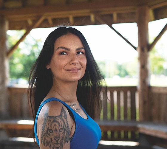 Indigenous student looking out inside Fire Arbour
