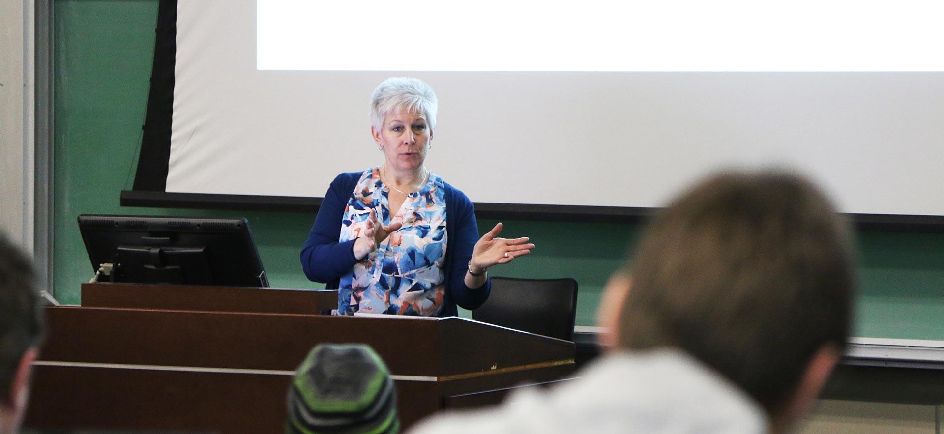 Instructor giving a class lecture.