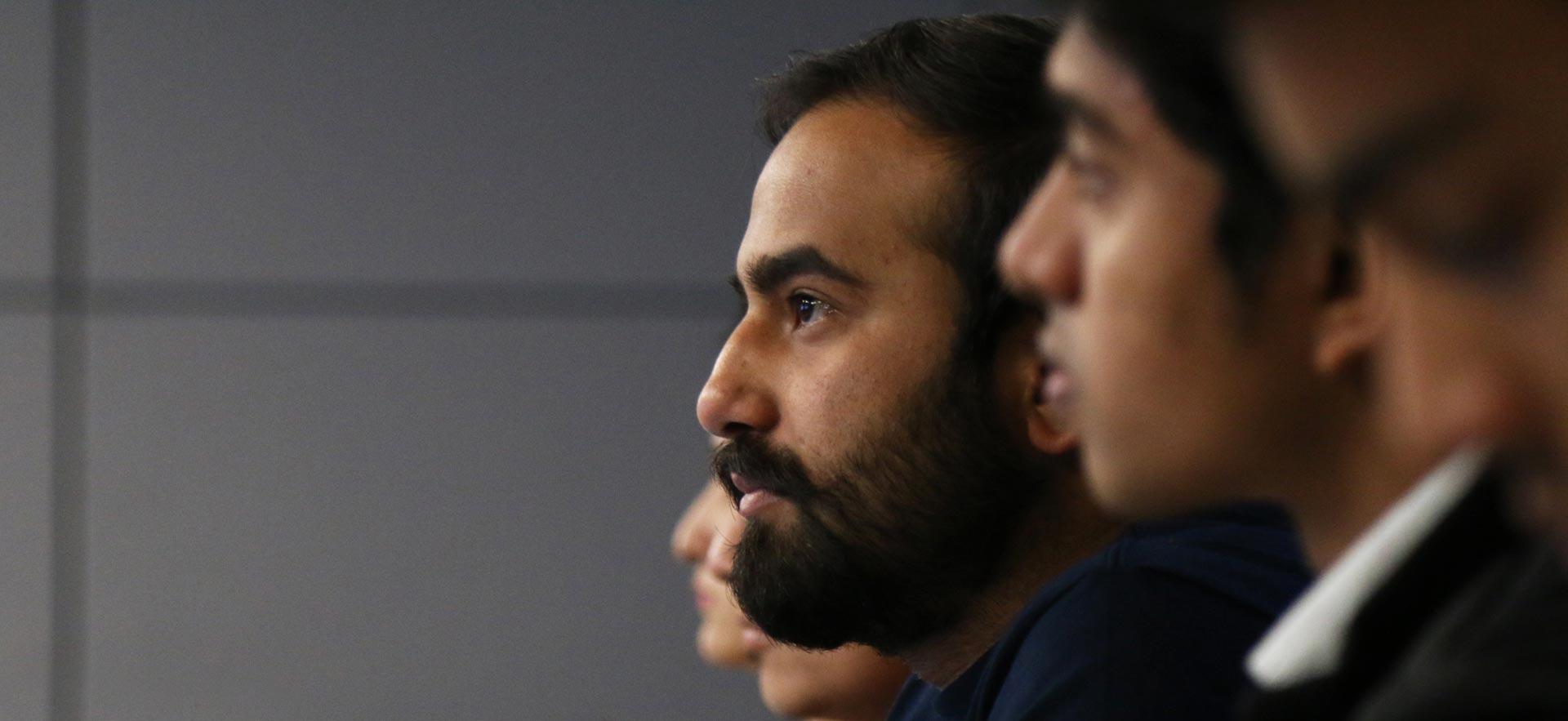 A group of Global Business Management students listen to the instructor’s lecture in class. 