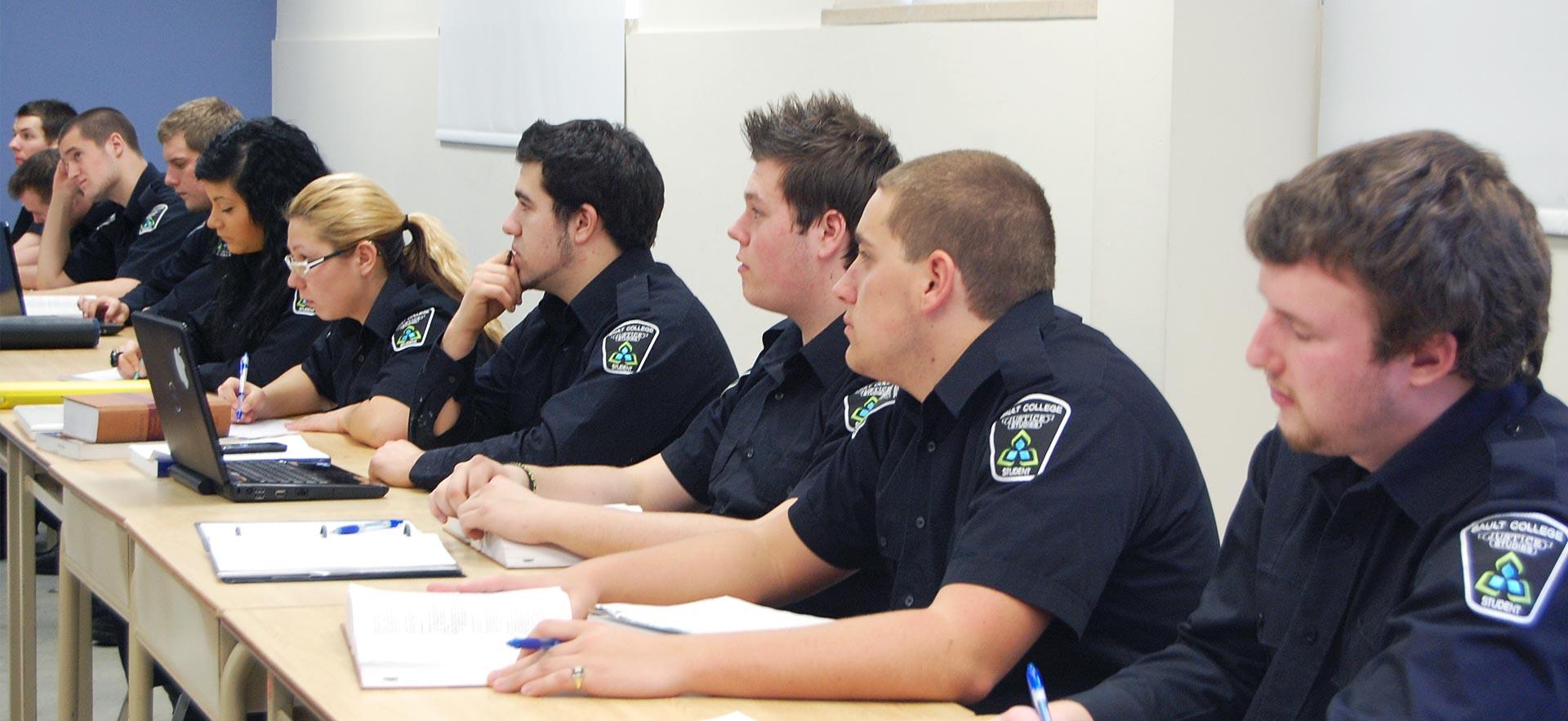 A Police Foundations class listens to a lecture. 