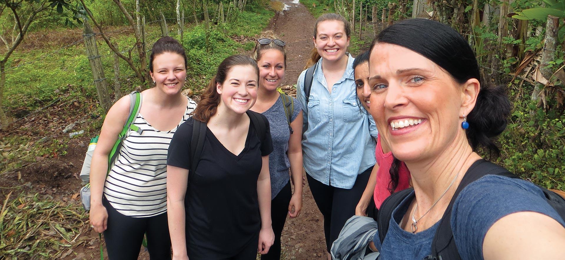 Nursing students and instructor smile for a photo while volunteering in Nicaragua.