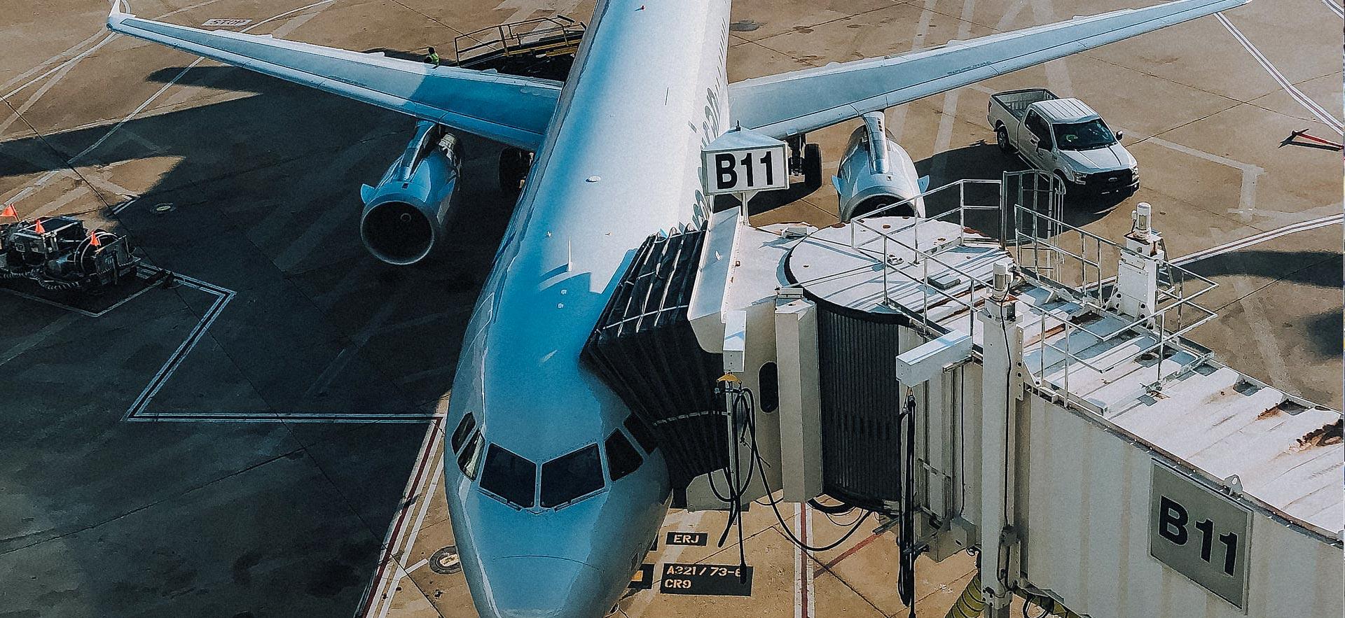 Above view of plane loading with passengers.