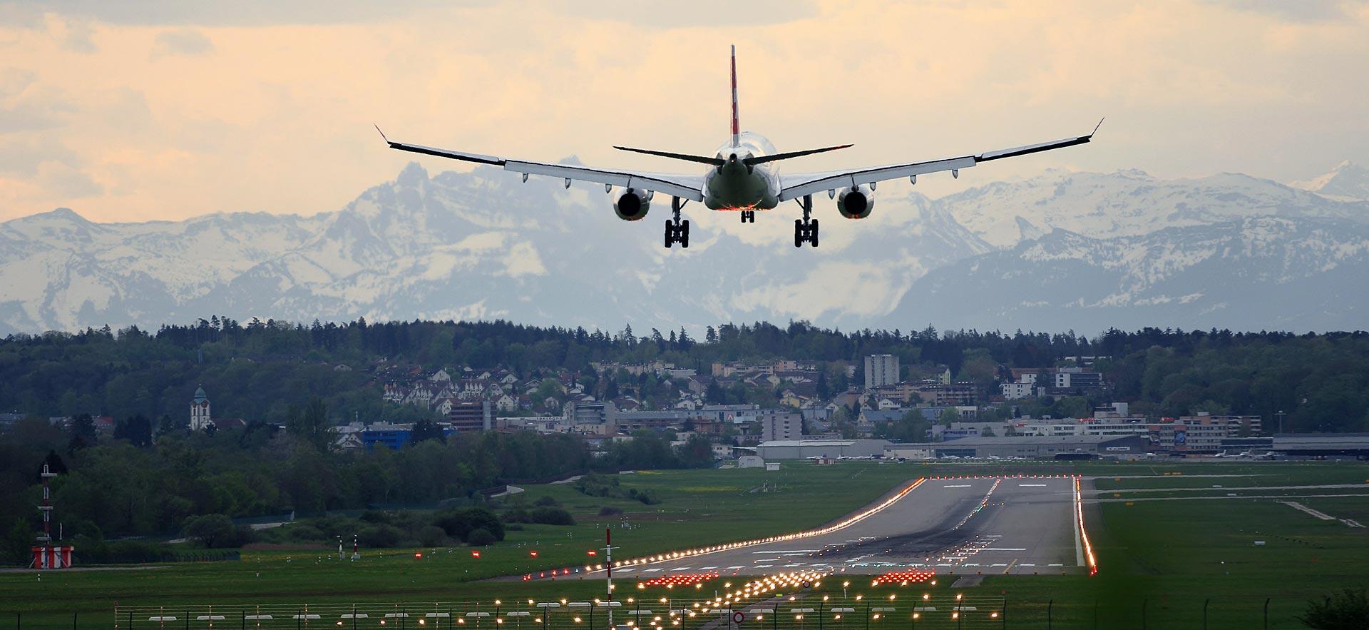 Airplane taking off in sunset.