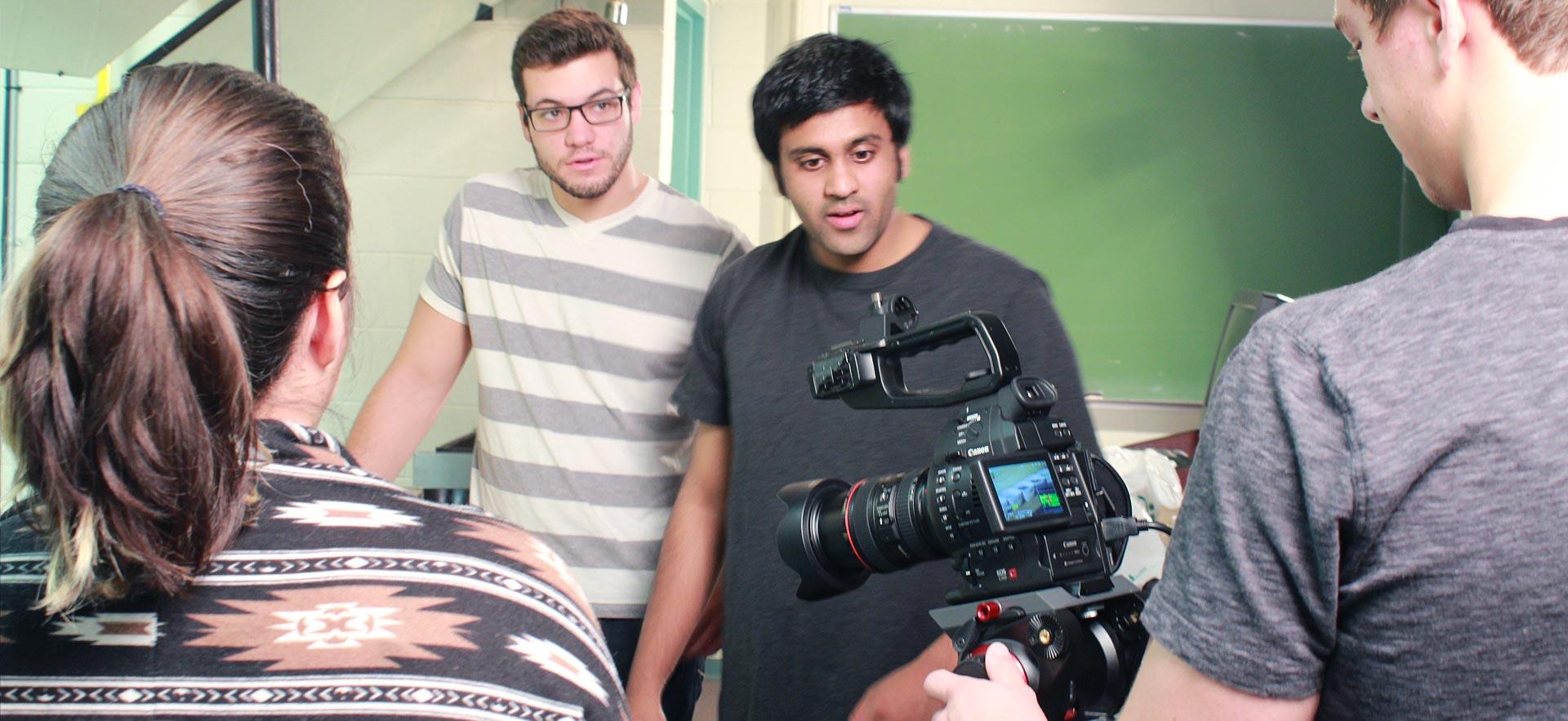 Digital video students prepare to shoot a video on the Sault College campus.