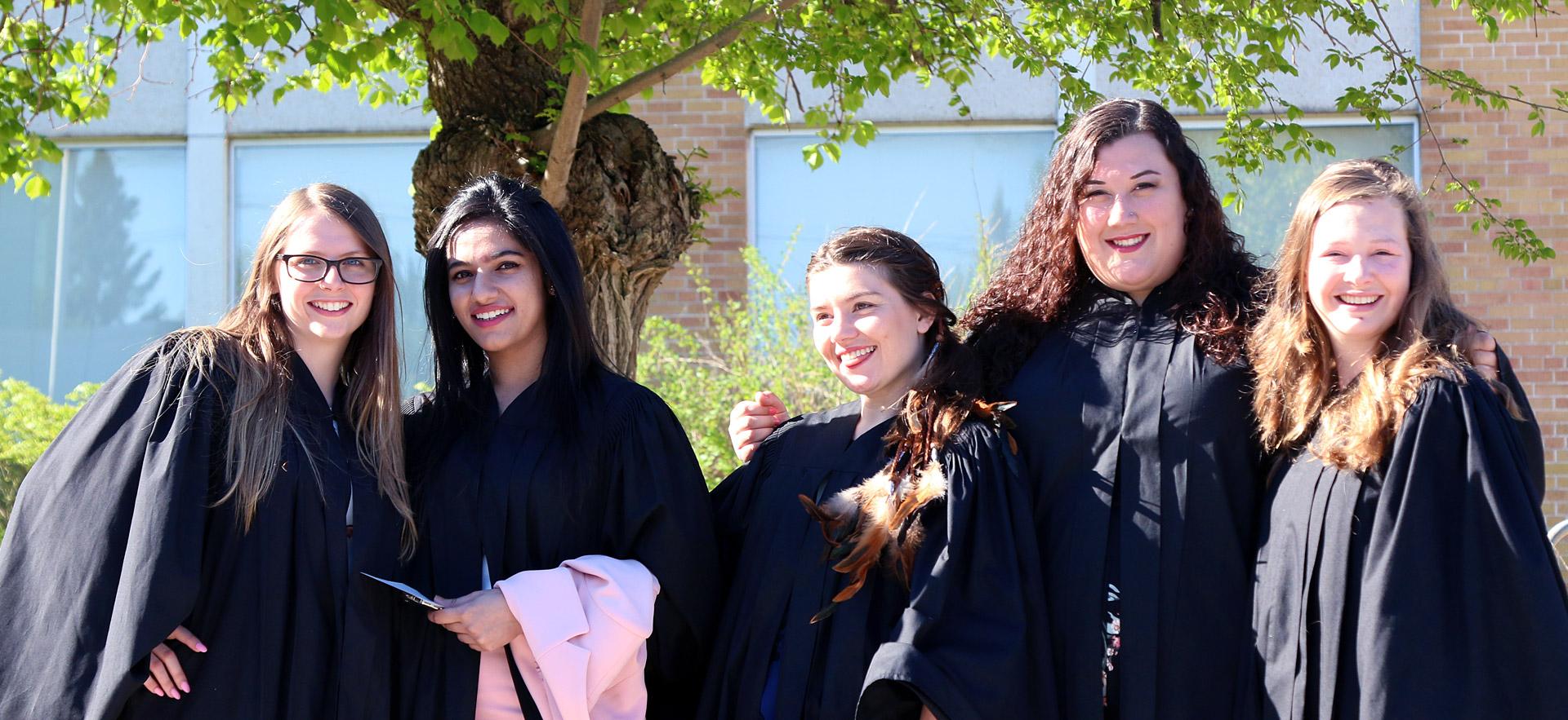 Group of happy female graduates