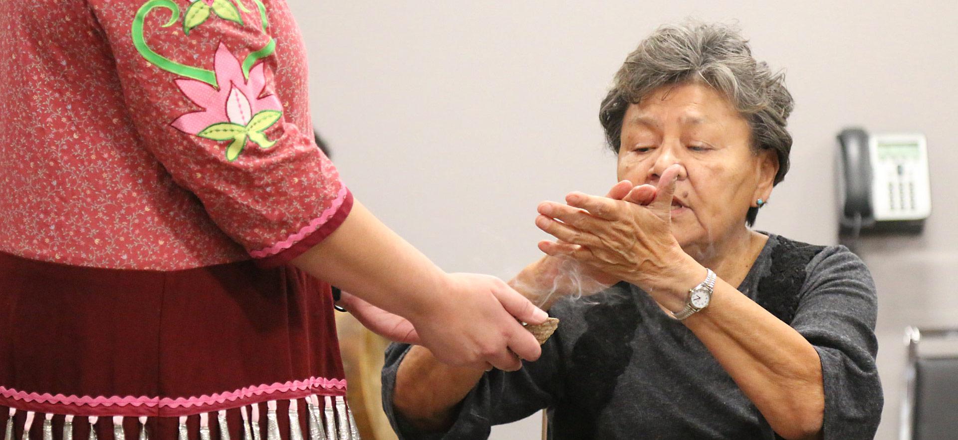 indigenous elder person hands together healing