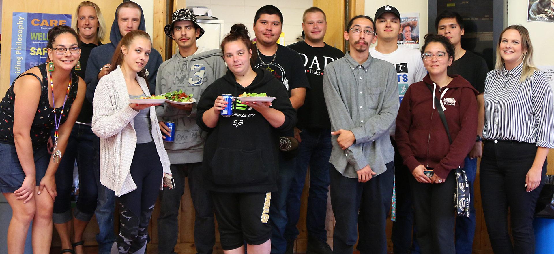 group of students posing for photo at indigenous event