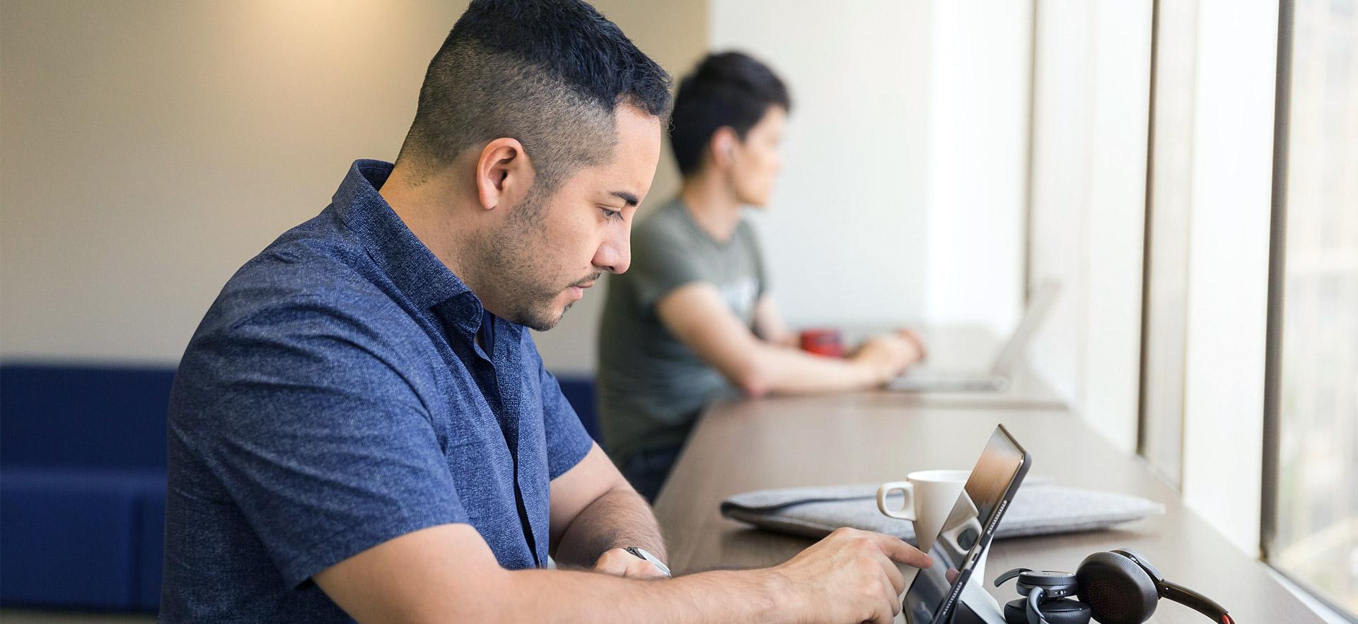 Male mature student doing research.