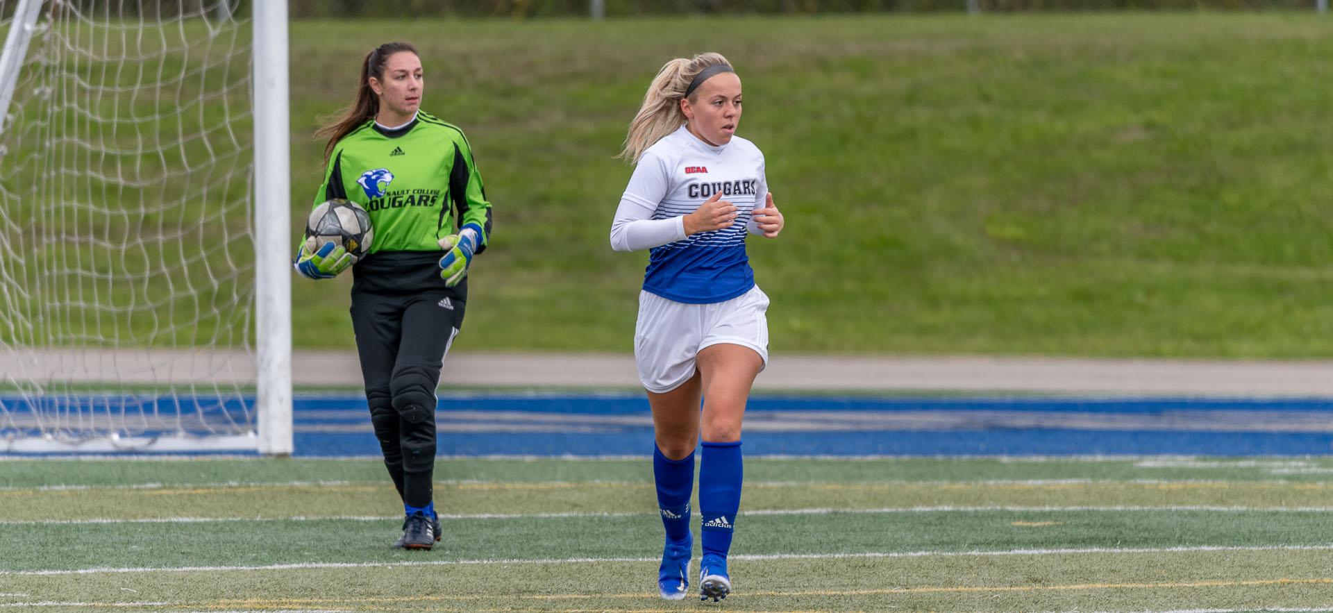 female soccer player with soccer ball 