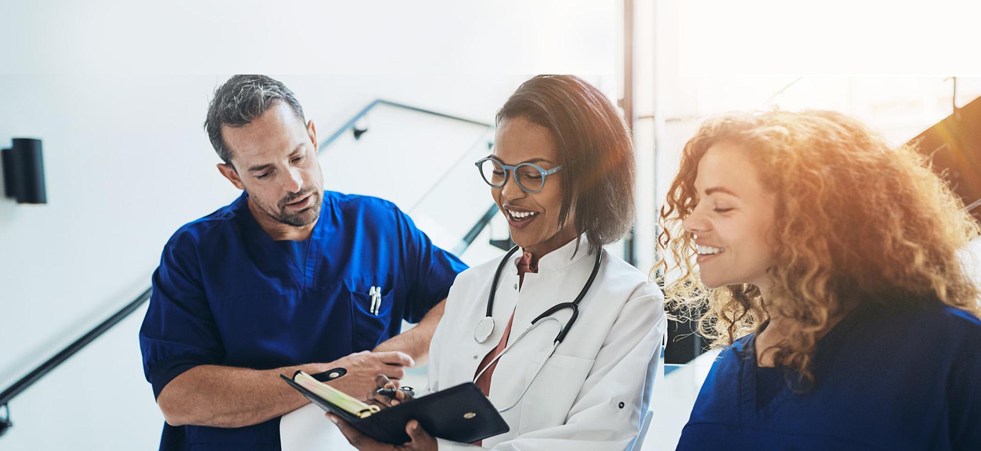 Group of healthcare professionals in discussion.