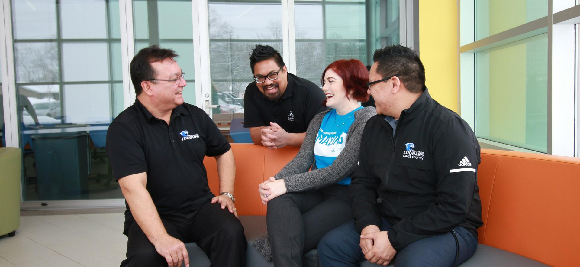 recruiters sitting on chair laughing