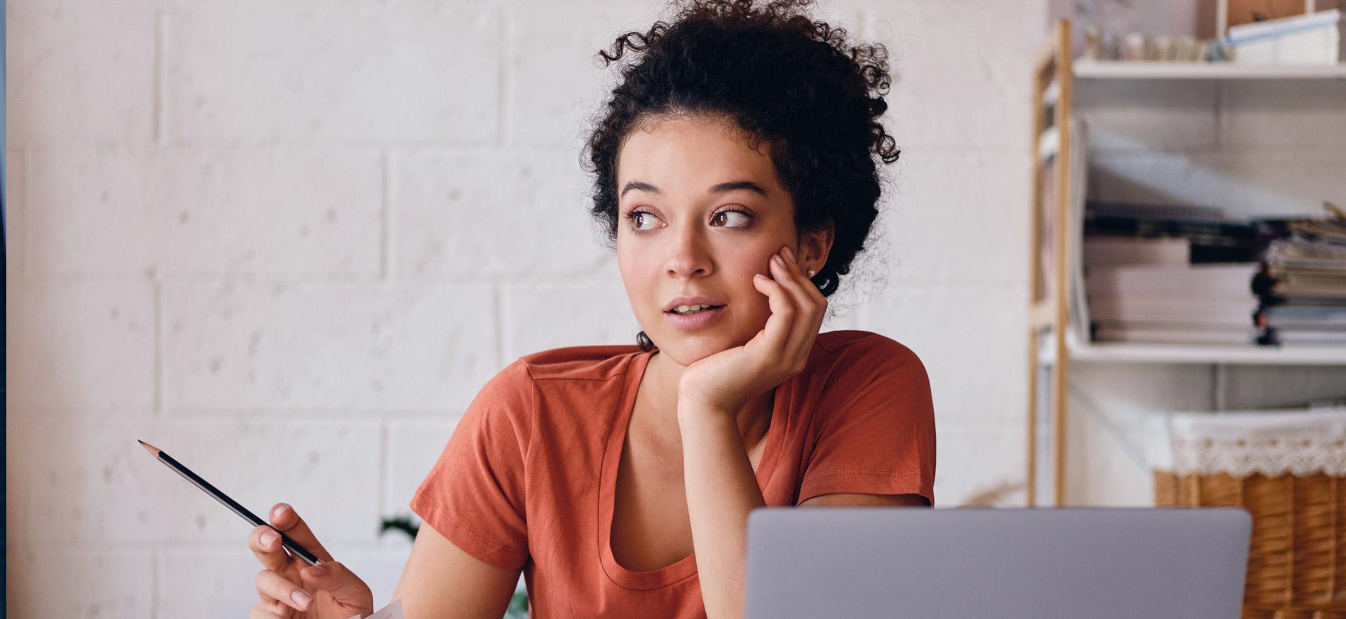 Female student working on a school project at home.