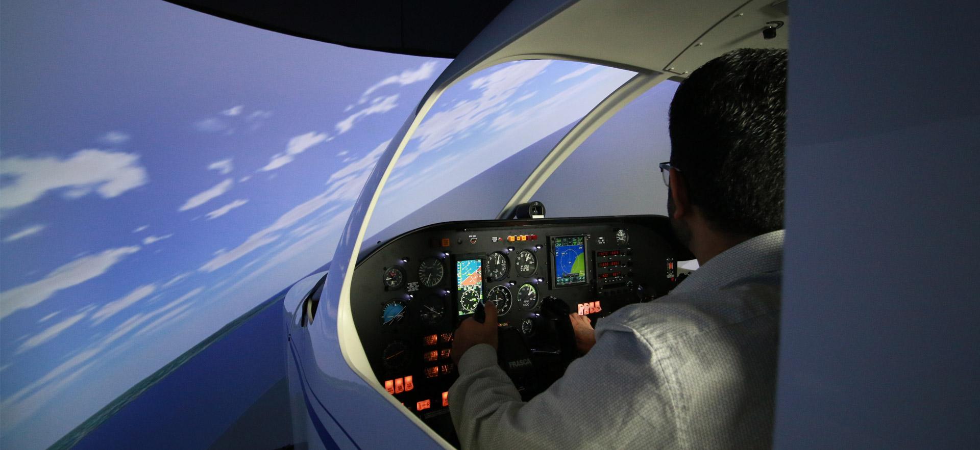 Male student in flight simulator.