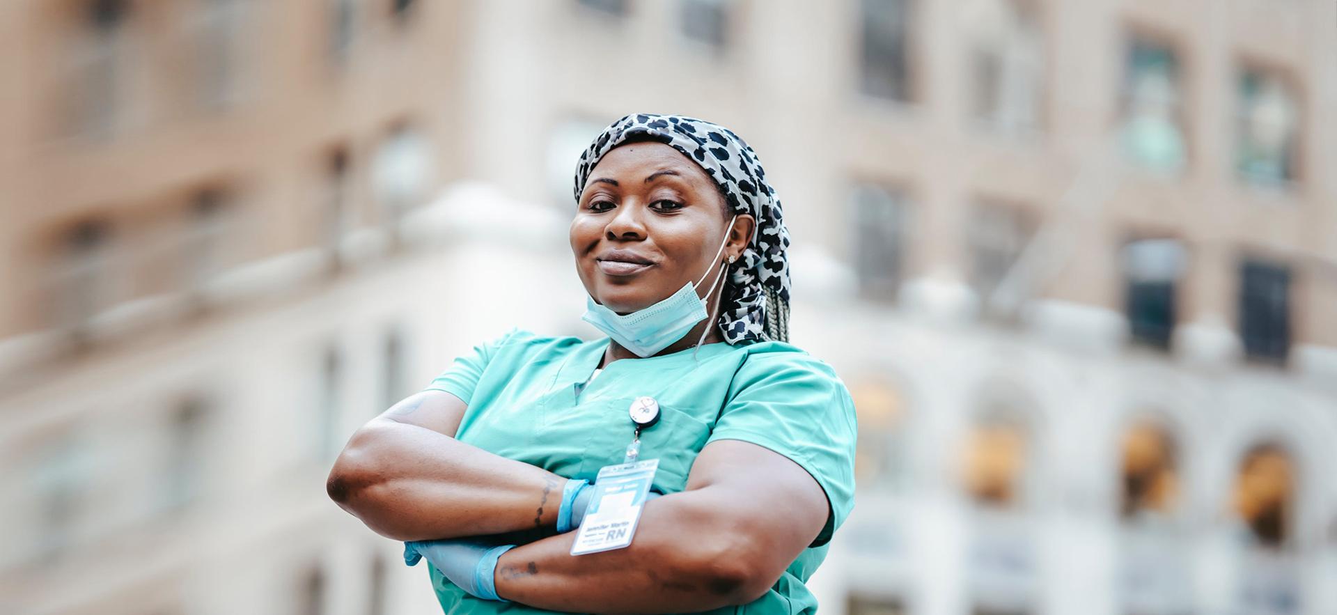 Nurse standing in front of camera with arms crossed