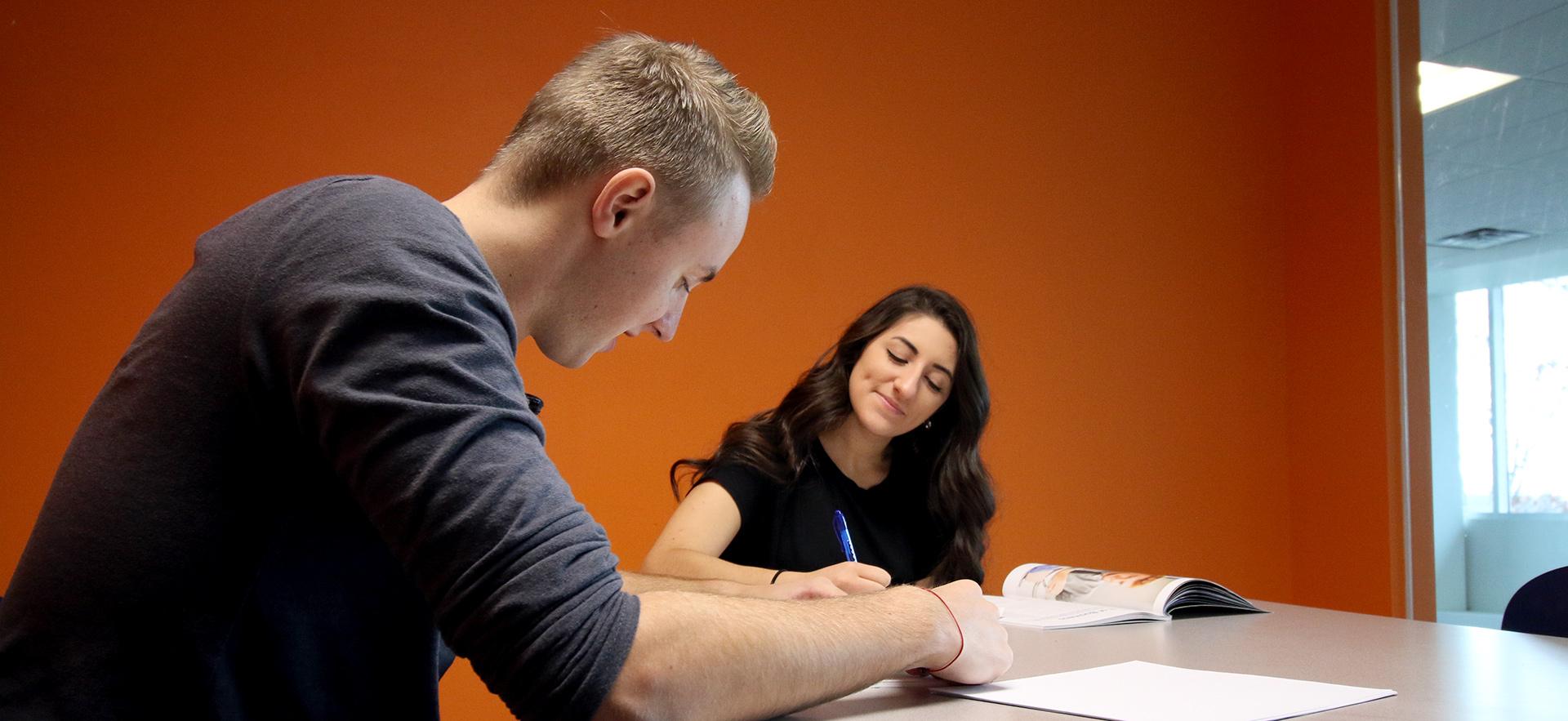 Students discussing at a table