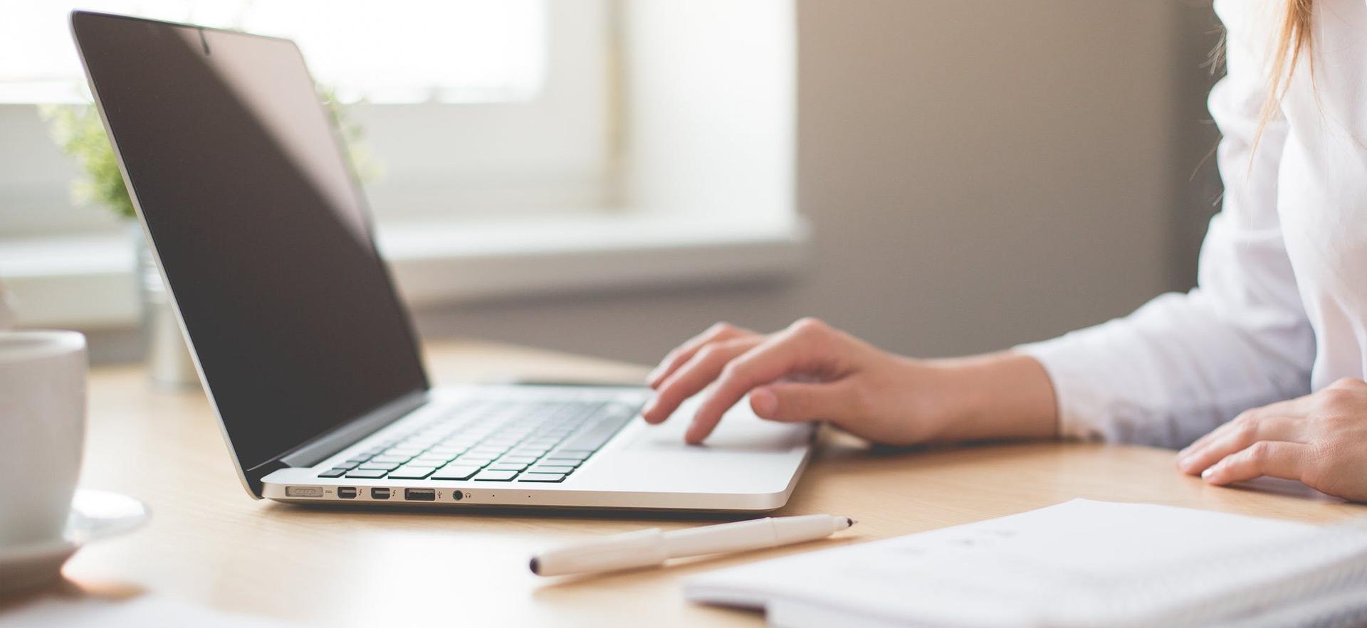 woman hand on computer keyboard