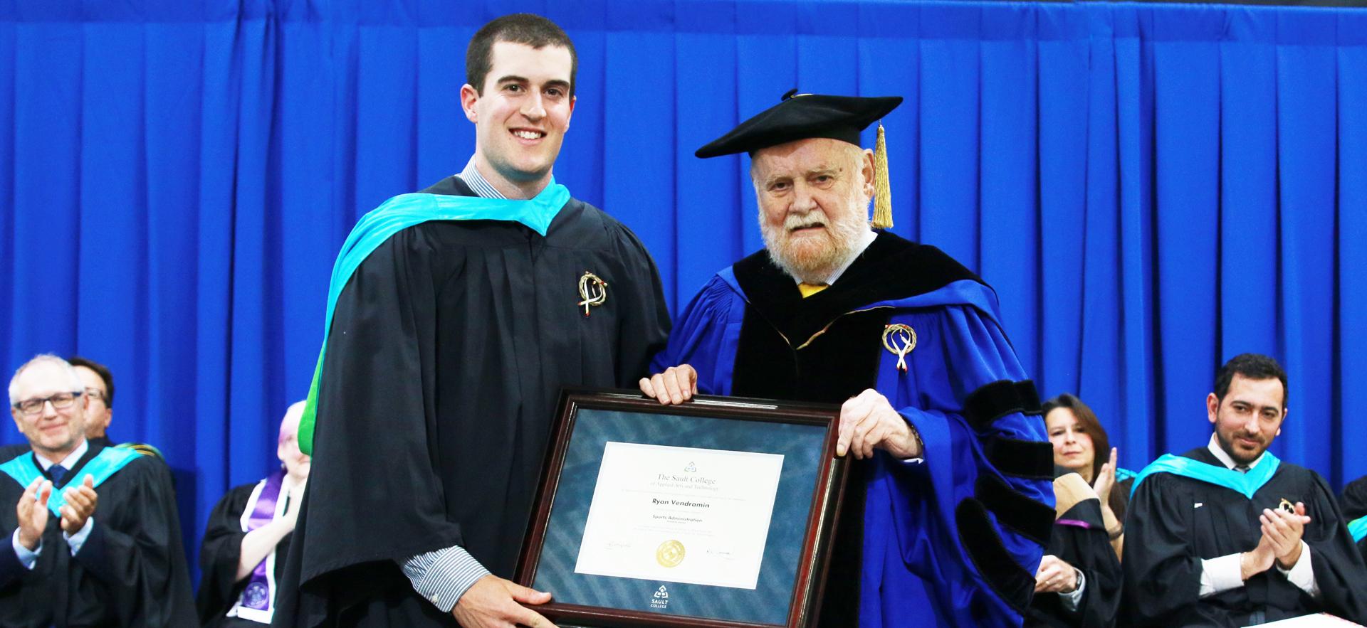 Dr. Ron Common presents honourary diploma