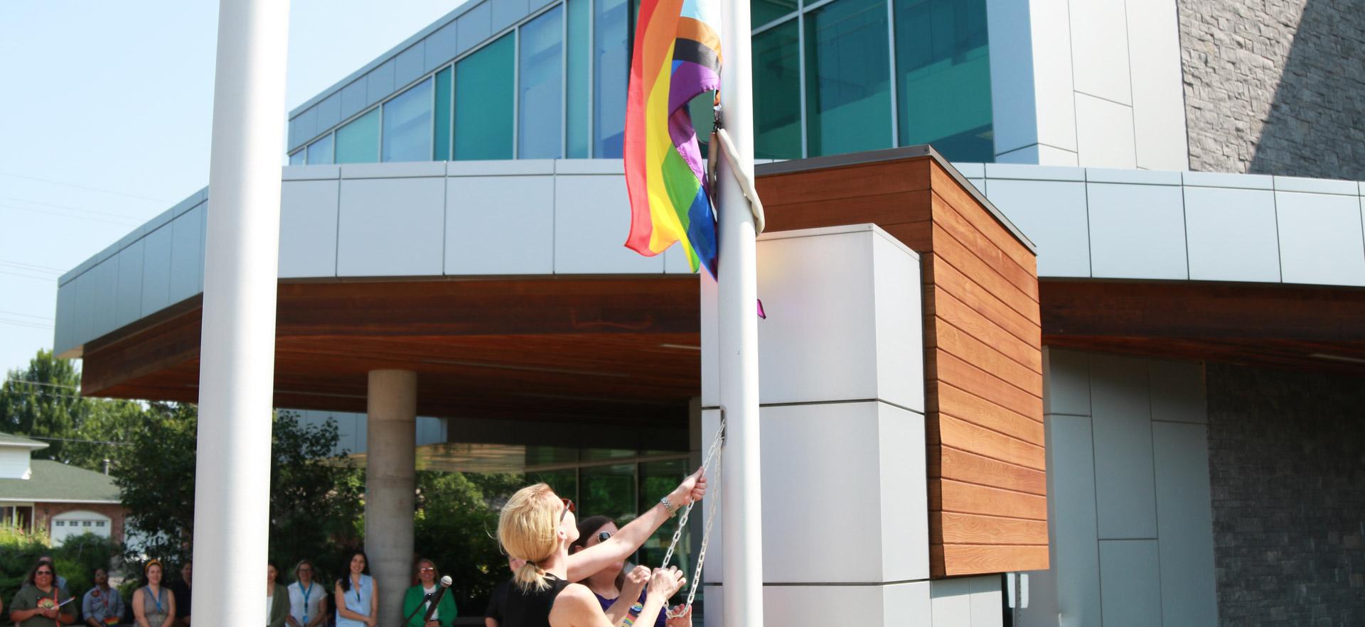 raising the flag outside of the campus 