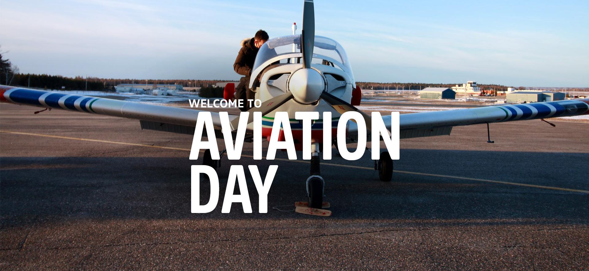 student on a plane landed at the Sault College Hangar with white text overlay that says Welcome to Aviation Day
