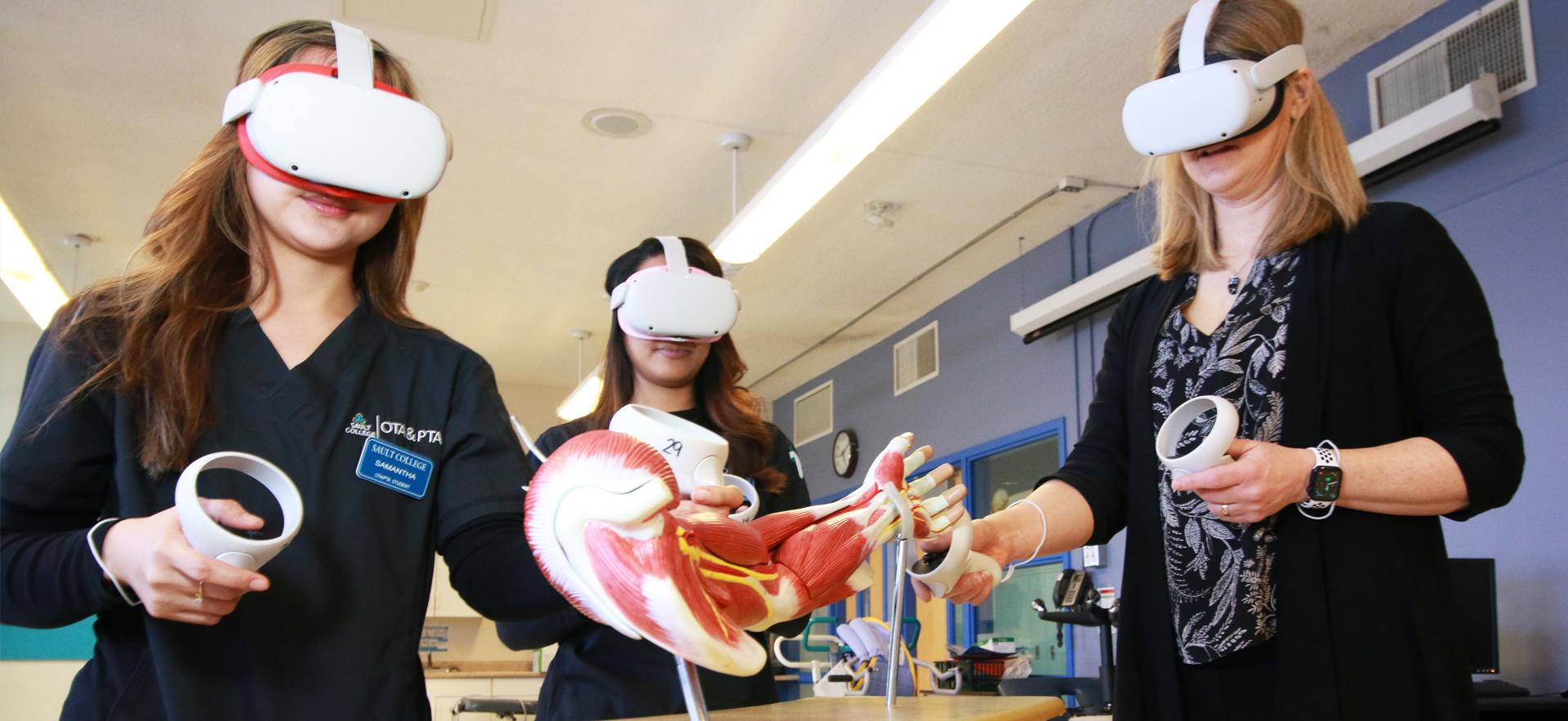 OTA & PTA instructor using virtual reality with two students to learn about muscles