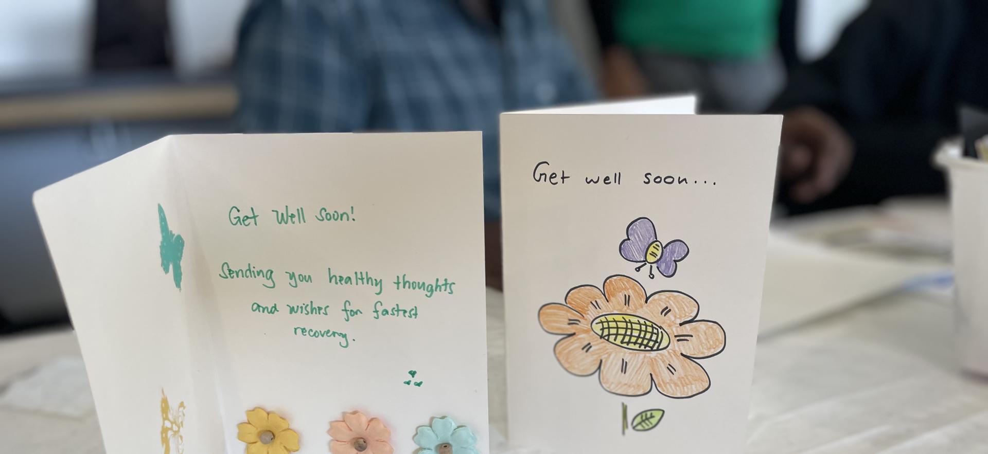 two get well cards, one is open wit words Get Well soon and one card with just the cover showing that states get well soon