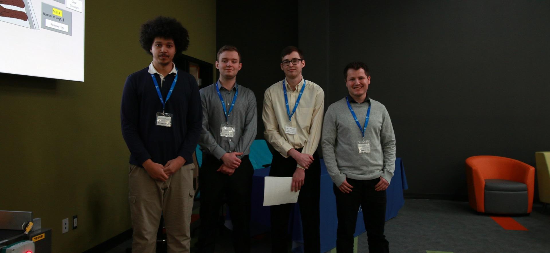 Engineering students smiling at camera after Boniferro Mills presentation