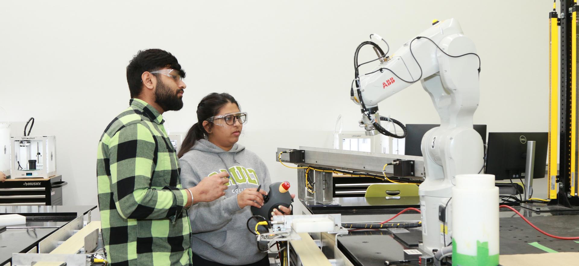 Engineering students working together in robotics lab