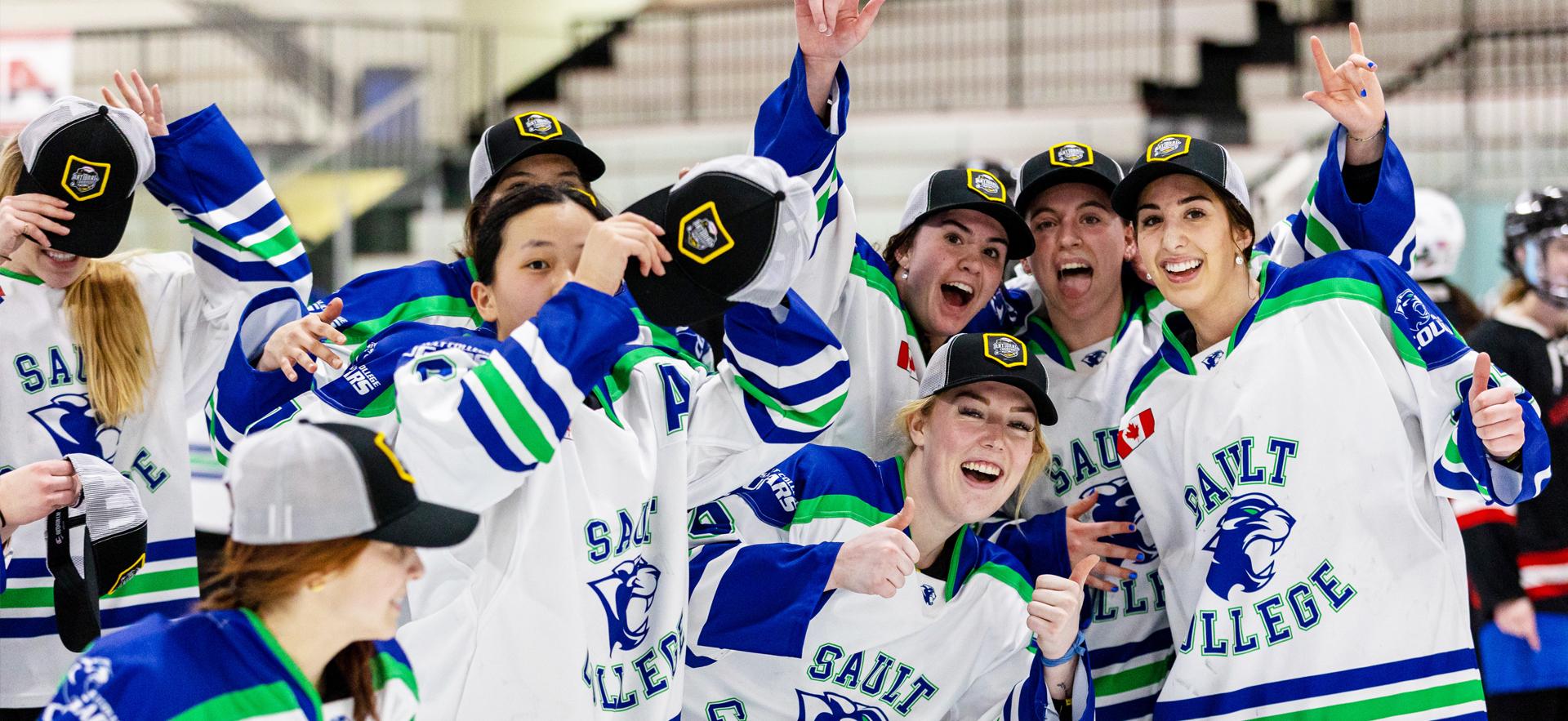 Women's ACHA Hockey Champions 2023 posed celebrating on ice