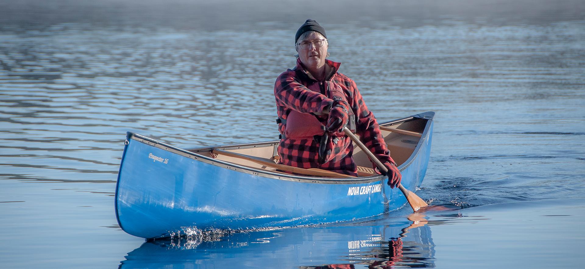 Kevin a graduate of our School of Natural Environment shown rowing a canoe